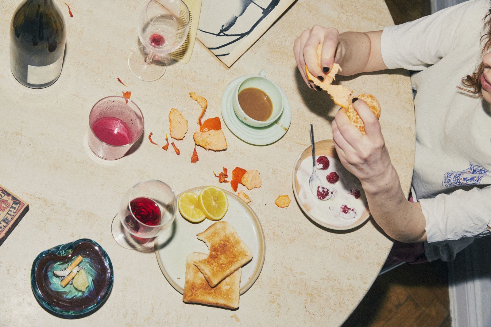 Overhead view of a shared table with food and drinks